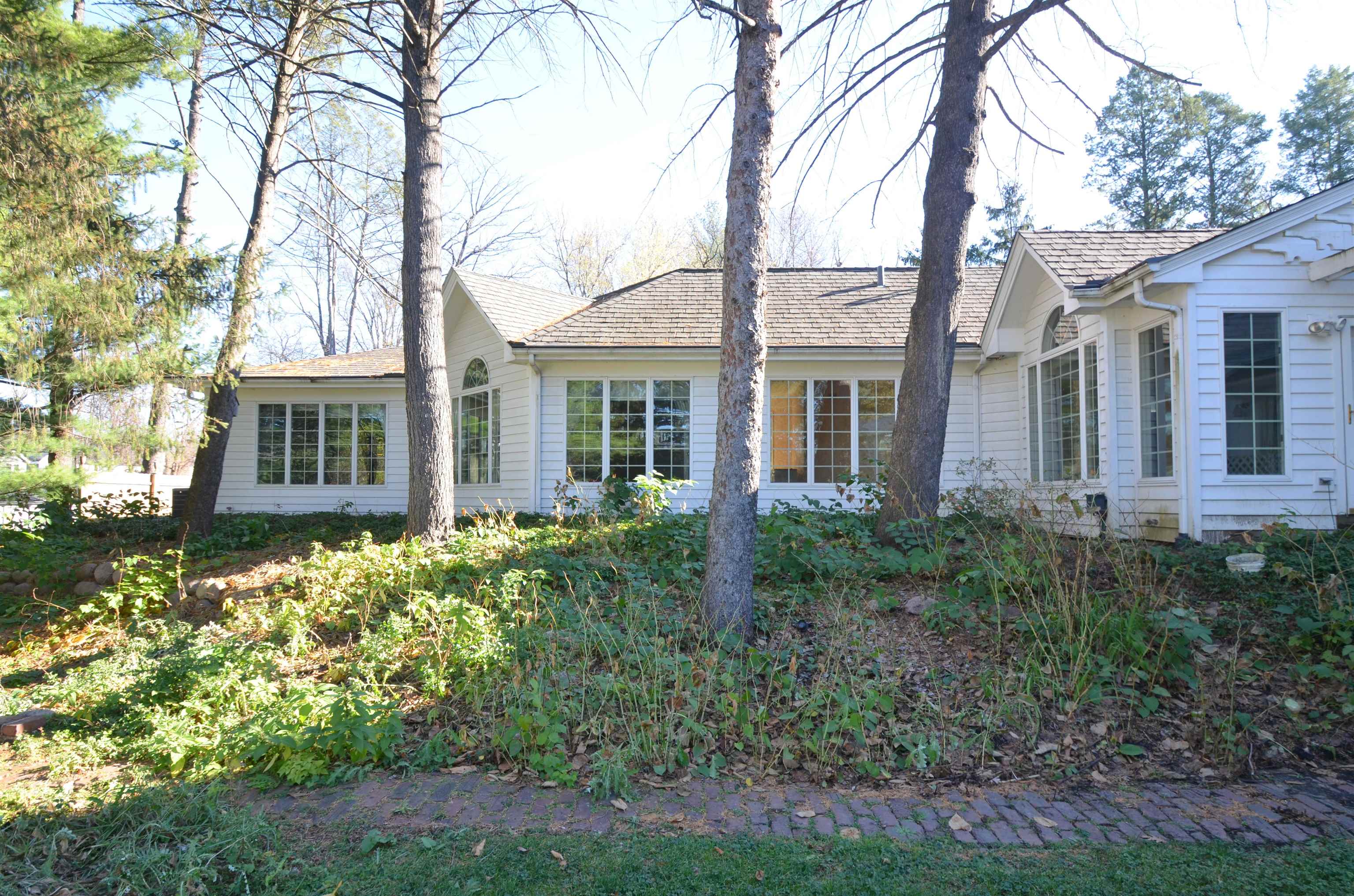 4980 Spring Brook Road Rockford, IL 61114 - Photo 45 of 50 front view of a house with a garden