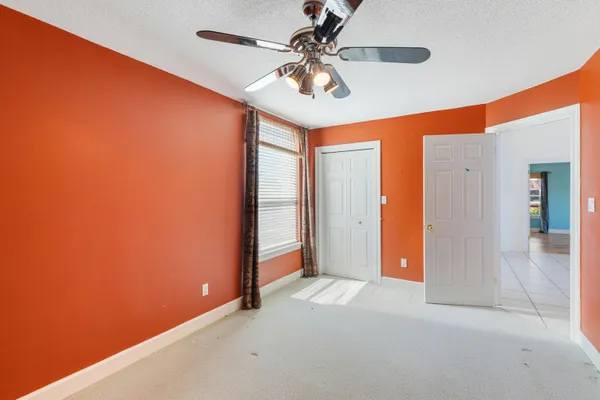 a kitchen with stainless steel appliances kitchen island granite countertop a refrigerator a oven and a sink with granite countertop