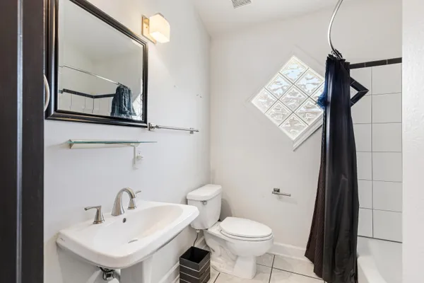 a bathroom with a sink a mirror and a shower