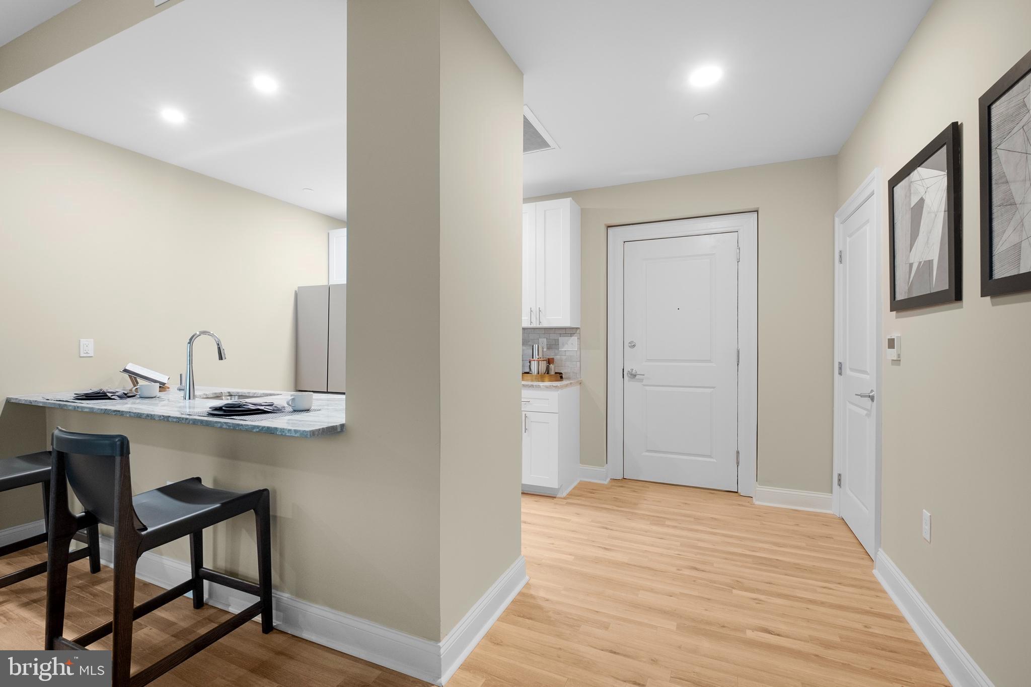1420-22 Chestnut Street, Unit 806 Philadelphia, PA 19102 - Photo 18 of 35 a view of a kitchen from the hallway