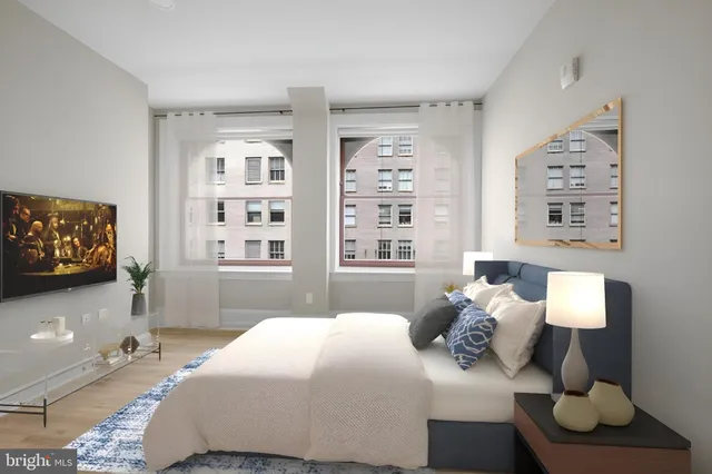 a bed room with a bed and a window