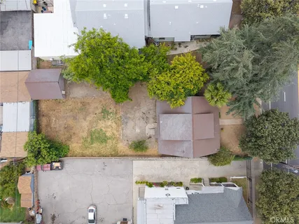 an aerial view of multiple houses with yard