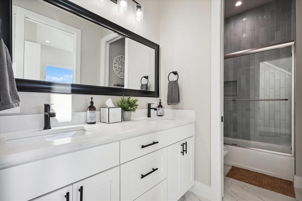 3 Blushing Bride Graford, TX 76449 - Photo 17 of 40 a bathroom with a double vanity sink mirror and a bathtub