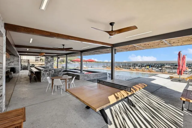 a living room with furniture a rug and white walls