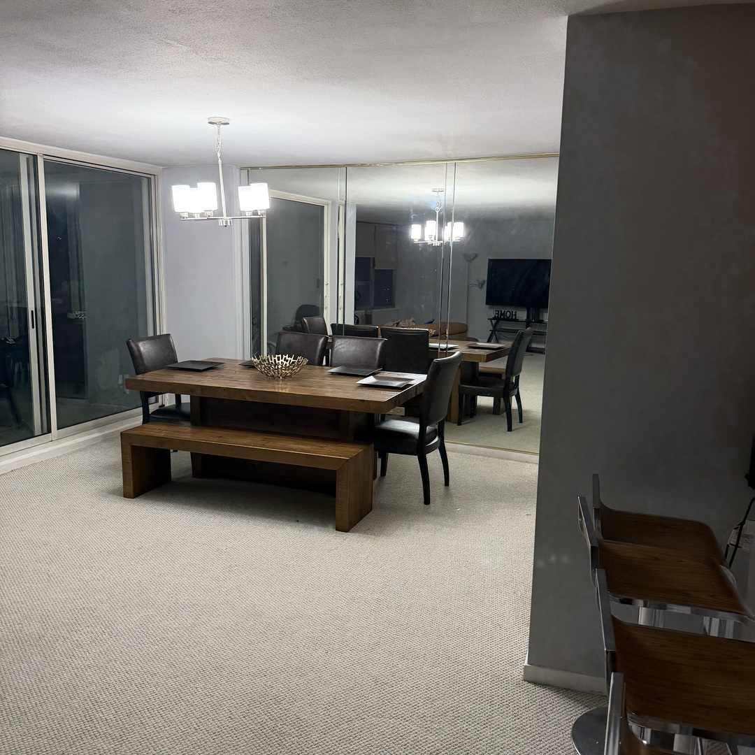 6101 North Sheridan Road, Unit 4A Chicago, IL 60660 - Photo 28 of 45 a living room with furniture a dining table and chairs