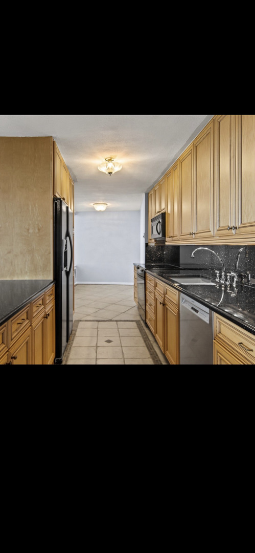 6101 North Sheridan Road, Unit 4A Chicago, IL 60660 - Photo 33 of 45 a view of kitchen with stainless steel appliances
