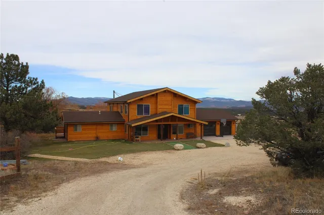 a view of a house with a mountain yard