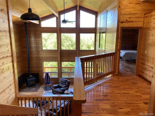 a bathroom with a granite countertop toilet sink and mirror