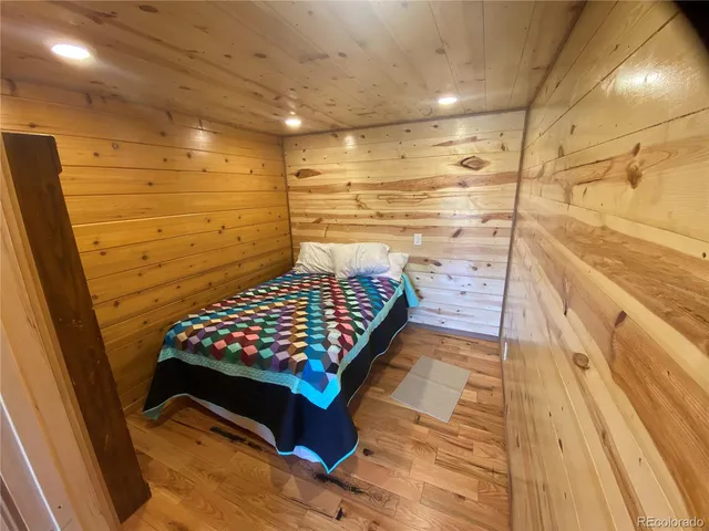 a living room with furniture a fireplace and a floor to ceiling window
