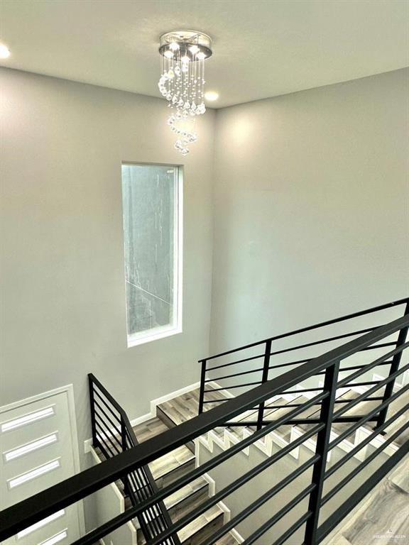 5402 North Crown Point Pharr, TX 78577 - Photo 12 of 19 a view of a room with wooden floor and staircase