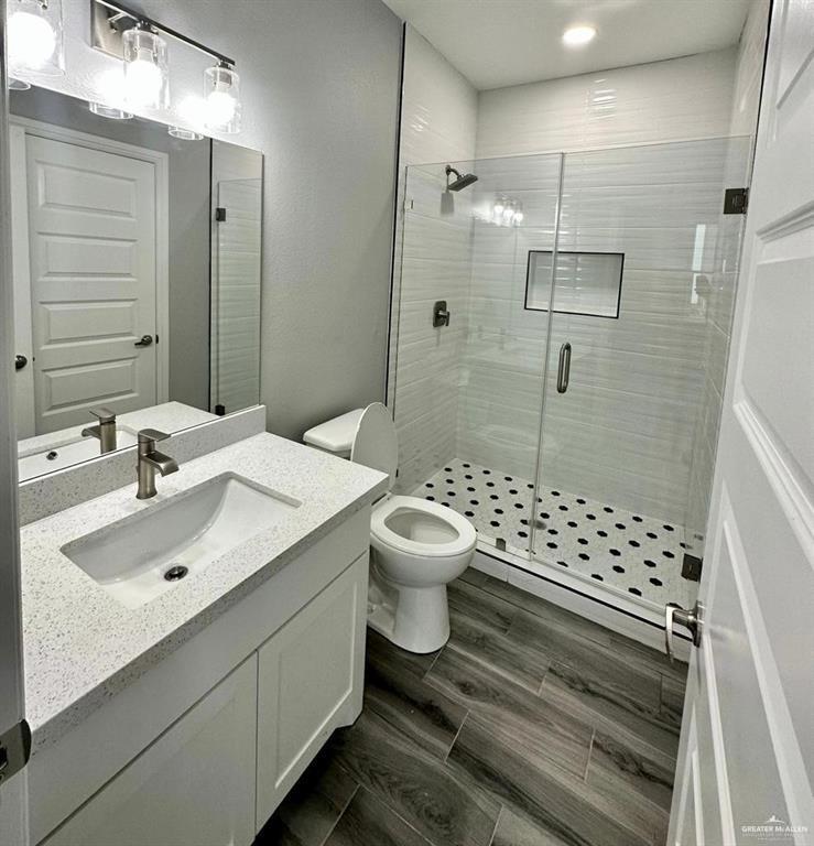5402 North Crown Point Pharr, TX 78577 - Photo 6 of 19 a bathroom with a sink toilet a shower and a mirror