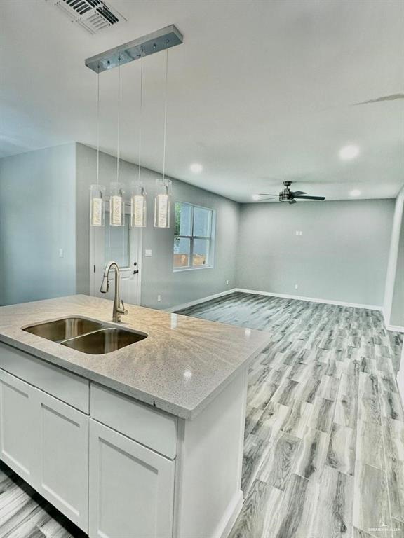 5402 North Crown Point Pharr, TX 78577 - Photo 7 of 19 a kitchen with a sink and cabinets