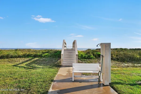 a view of a yard with an ocean view