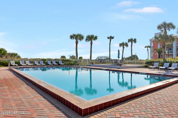 a view of swimming pool with chairs