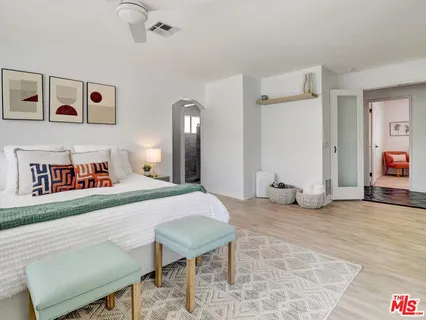 a bedroom with a bed and a table in it