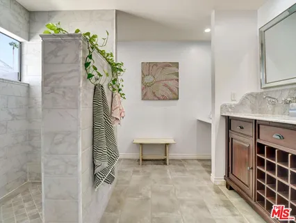 a view of a hallway with paintings on the wall