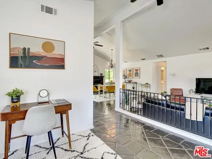 a view of a workspace with furniture