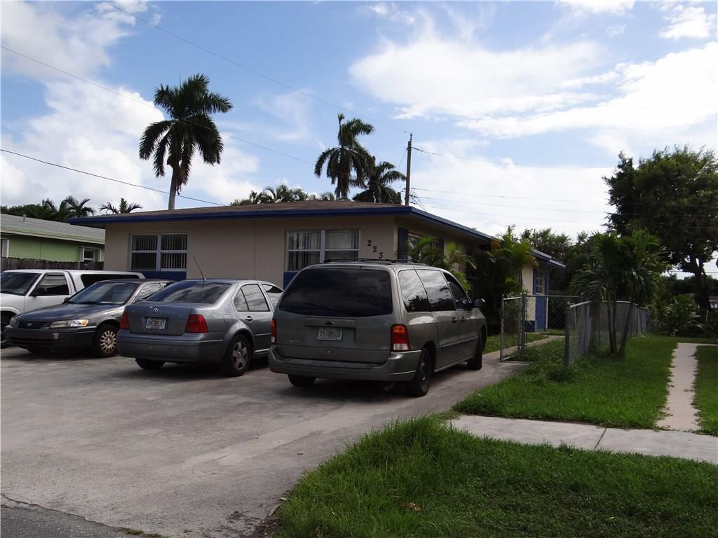 223 Southwest 9th Street Hallandale Beach, FL 33009 - Photo 1 of 3 a car parked in front of a house