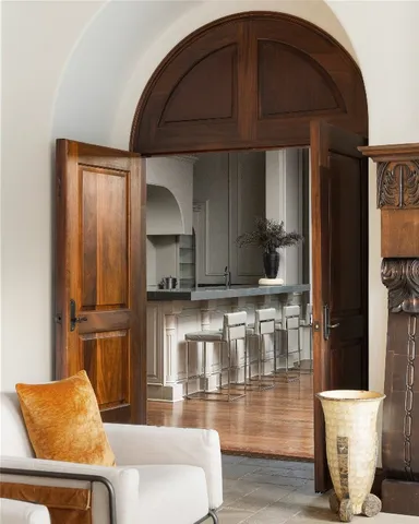 a kitchen with stainless steel appliances kitchen island granite countertop a refrigerator and microwave