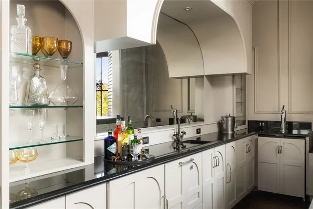a kitchen with counter top space and sink