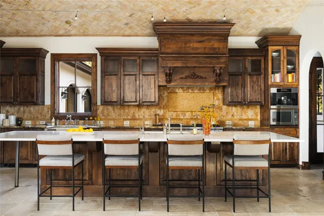 a kitchen with a sink and cabinets