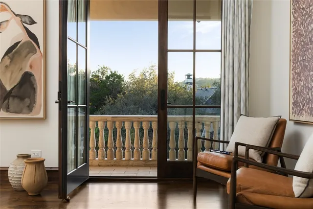 a balcony view with a couch and a table