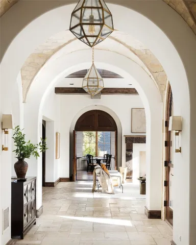 a view of hall way with furniture