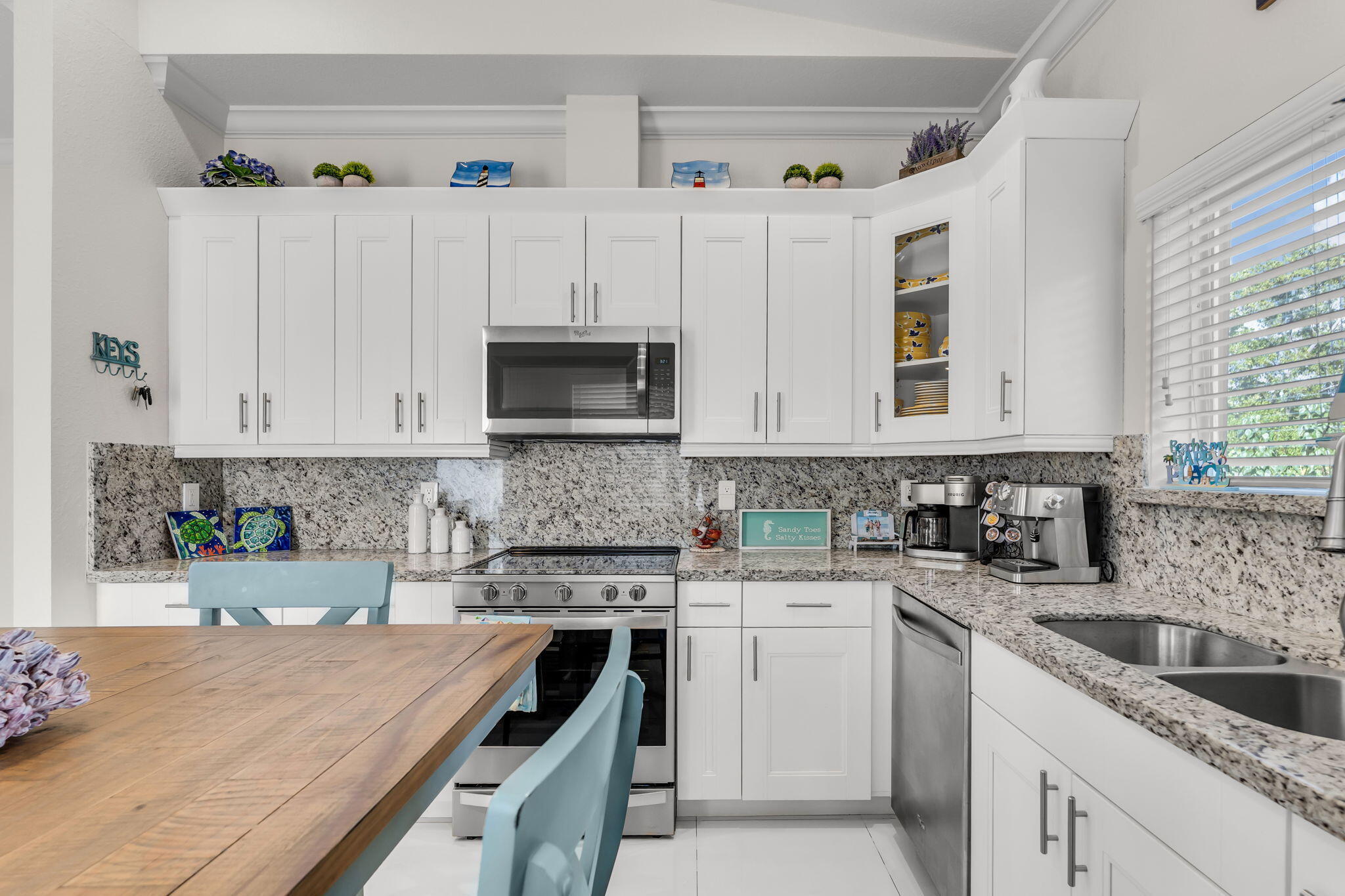 22 Tarpon Avenue Key Largo, FL 33037 - Photo 12 of 43 a kitchen with cabinets appliances a sink and a counter top space