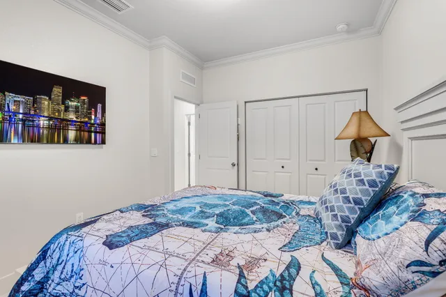 a dining room with stainless steel appliances granite countertop a kitchen island hardwood floor sink stove and white cabinets