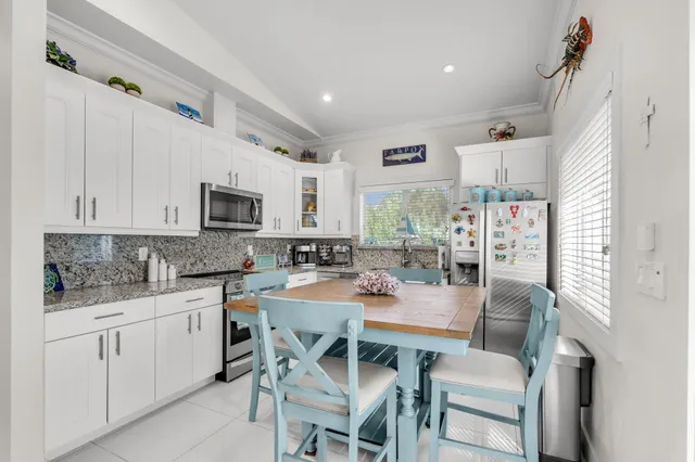a view of walk in closet with clothes
