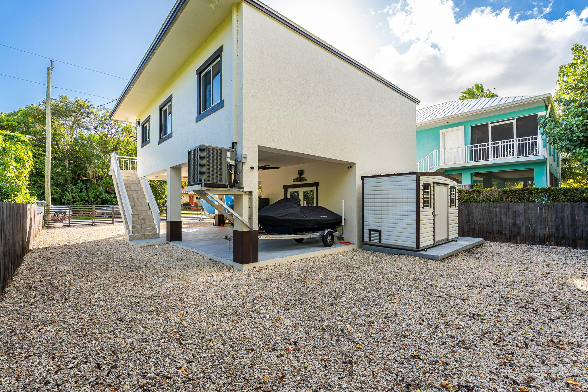 22 Tarpon Avenue Key Largo, FL 33037 - Photo 22 of 43 a view of a chairs in back yard of the house