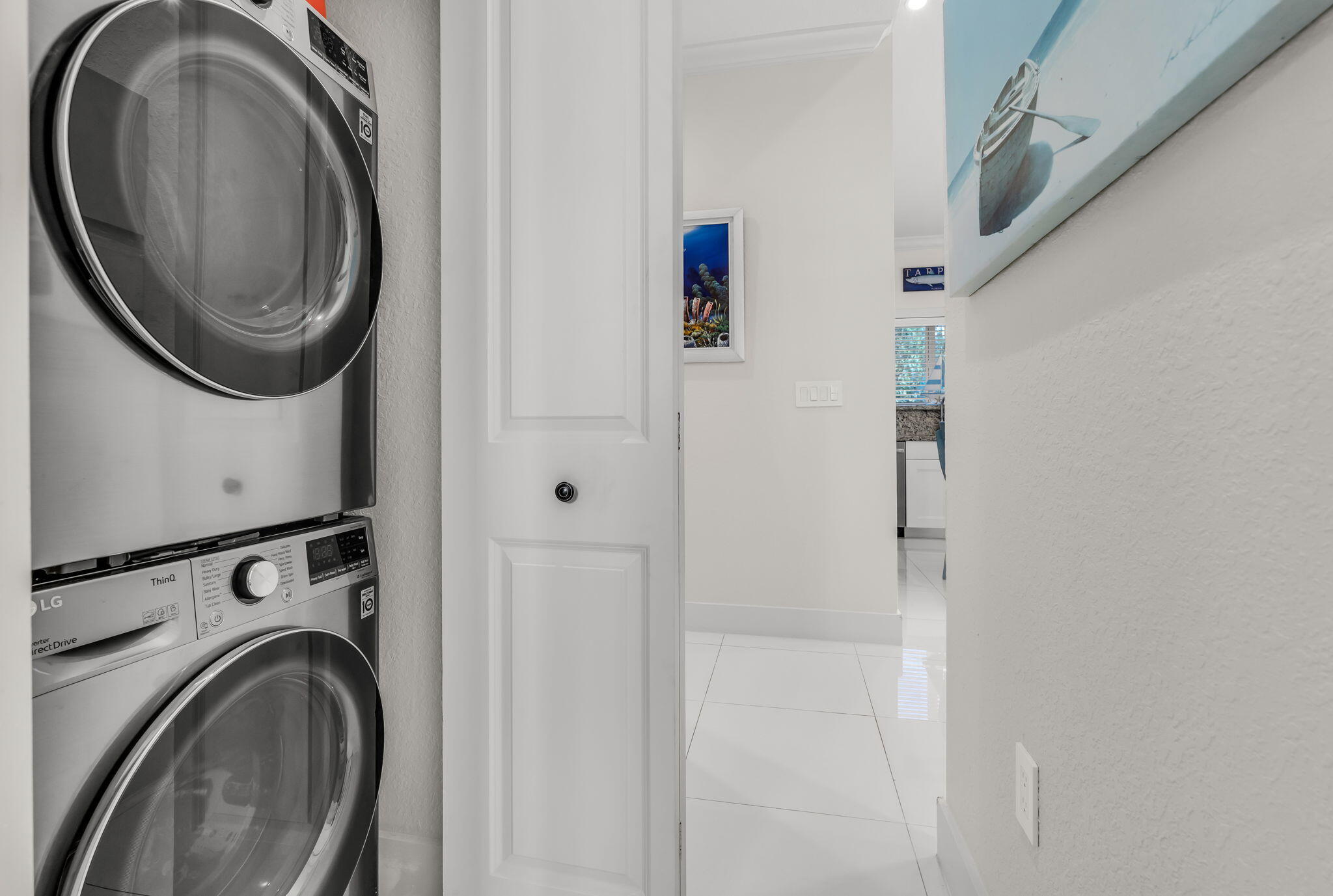 22 Tarpon Avenue Key Largo, FL 33037 - Photo 25 of 43 a view of a hallway with washer and dryer
