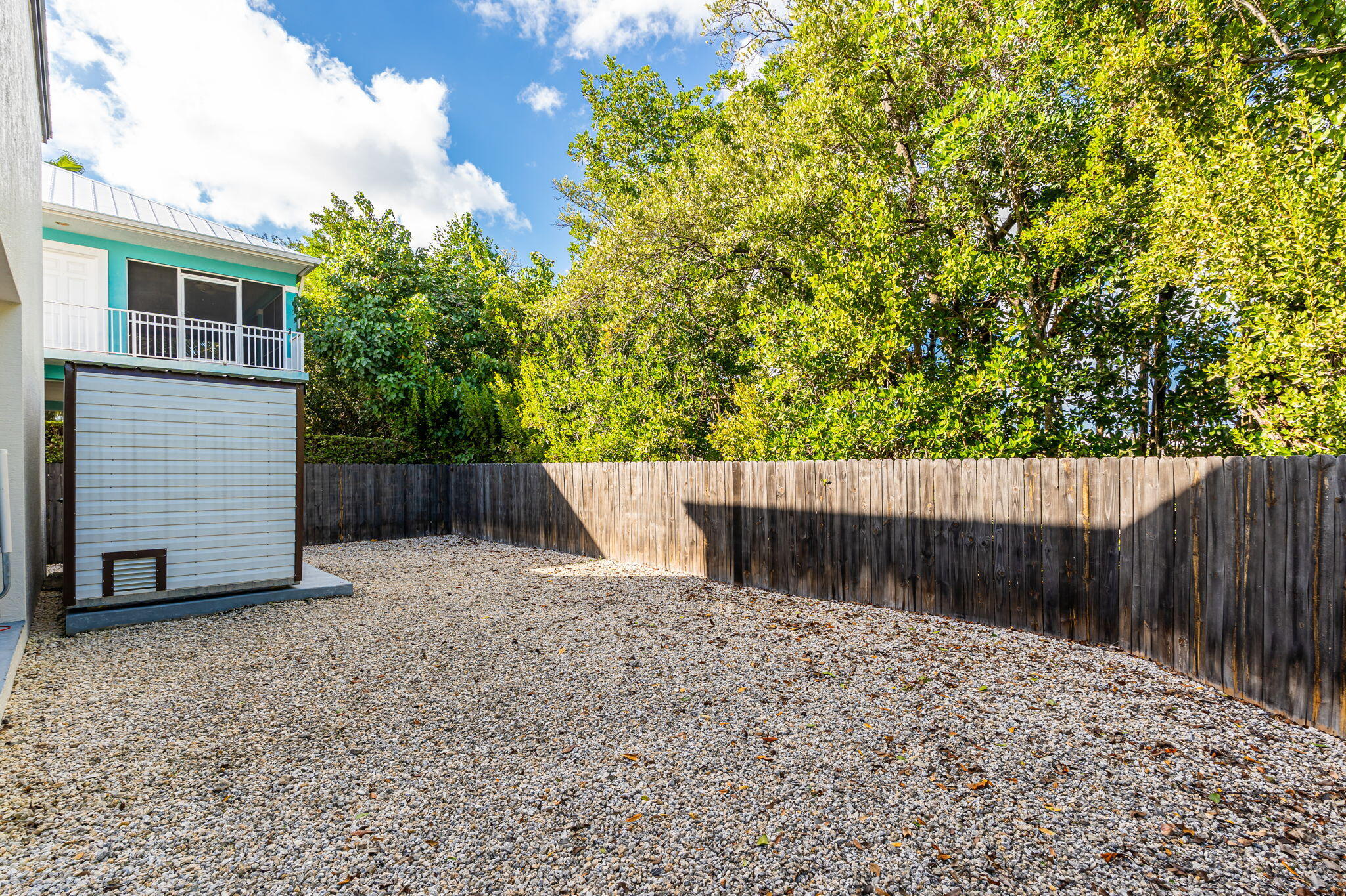 22 Tarpon Avenue Key Largo, FL 33037 - Photo 26 of 43 a view of backyard with small cabin and wooden fencing