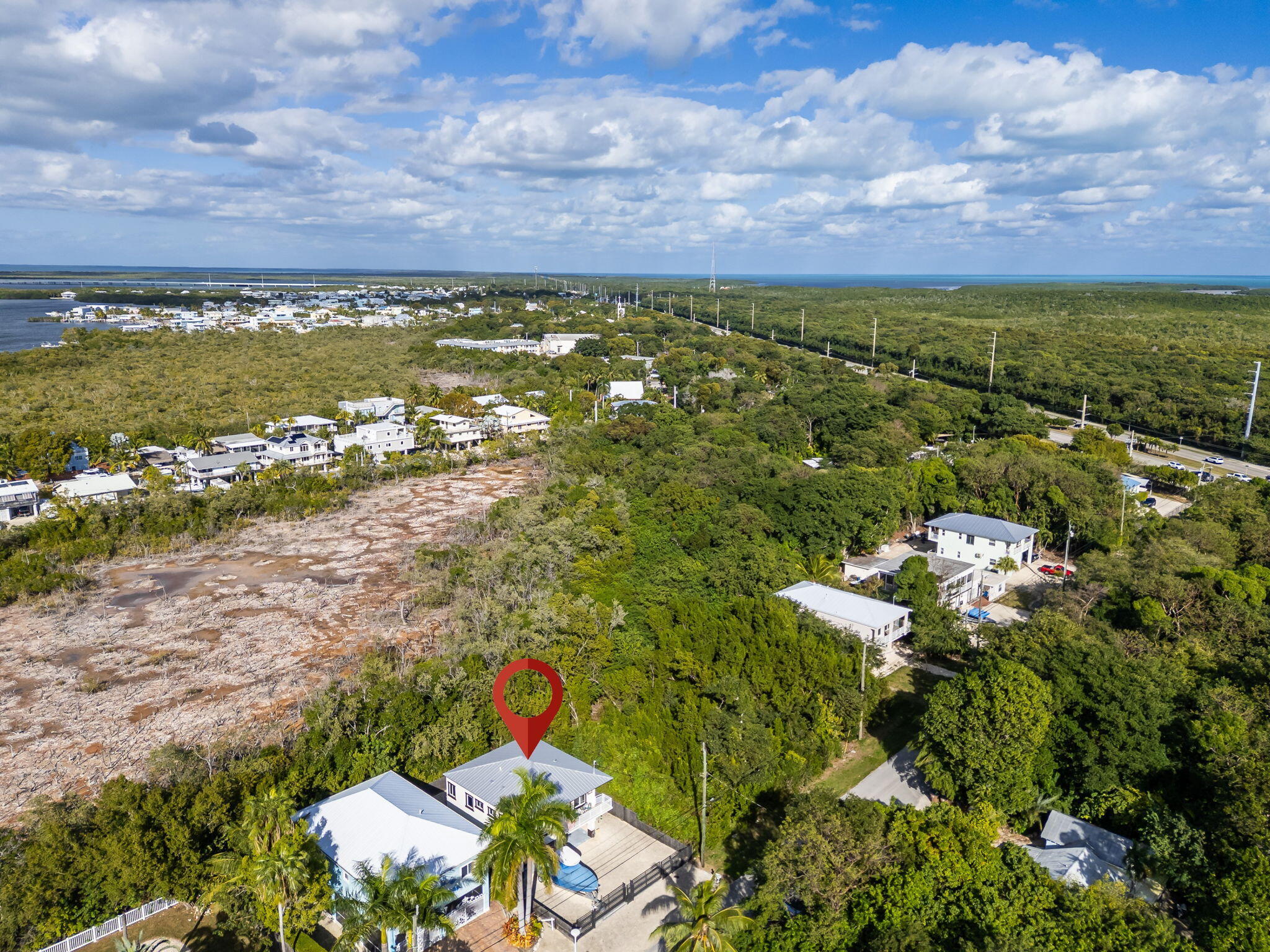22 Tarpon Avenue Key Largo, FL 33037 - Photo 41 of 43 a view of a lake with houses in the back