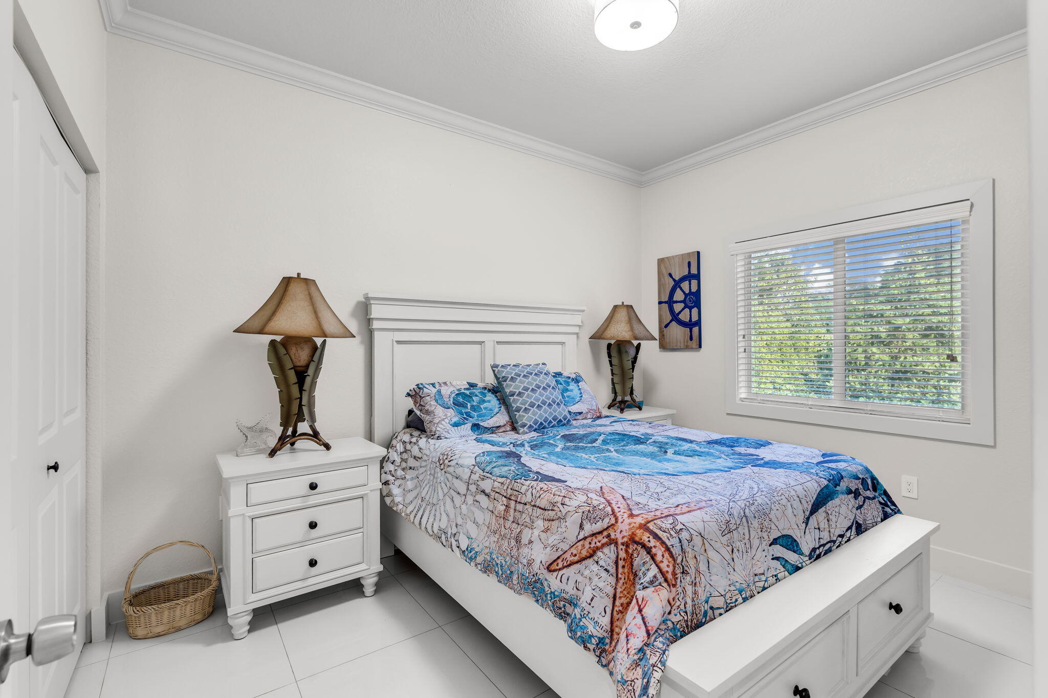 22 Tarpon Avenue Key Largo, FL 33037 - Photo 10 of 43 a bedroom with a bed and large windows