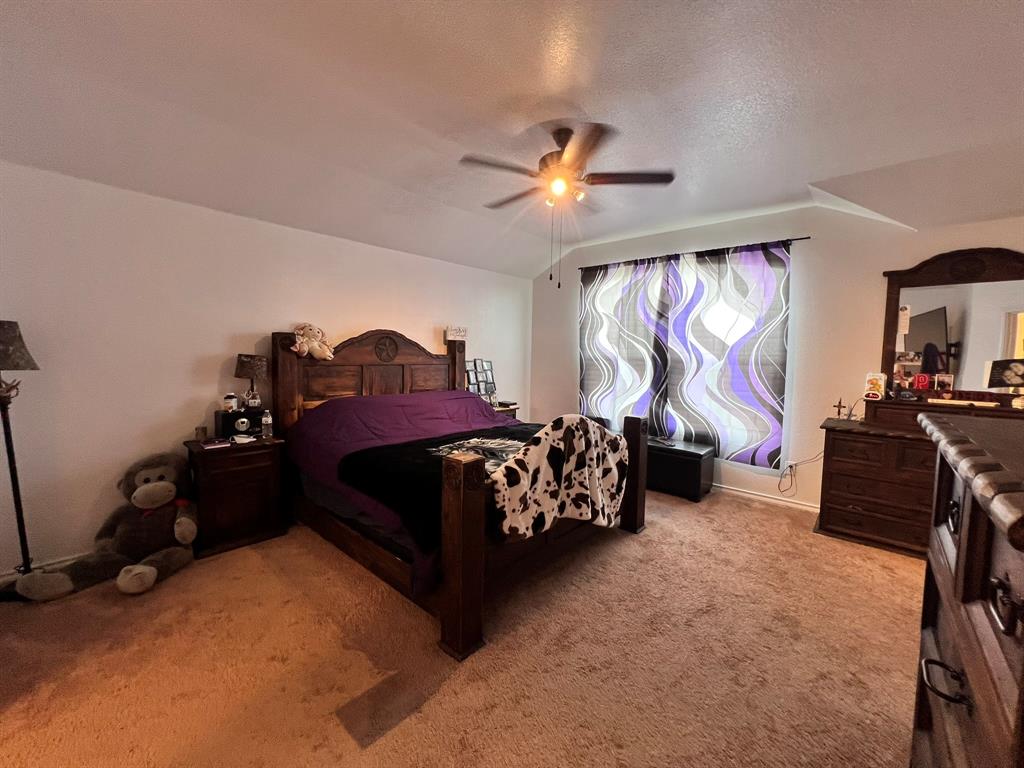 324 Fairgrounds Lane Ponder, TX 76259 - Photo 33 of 40 a bedroom with furniture and a large window