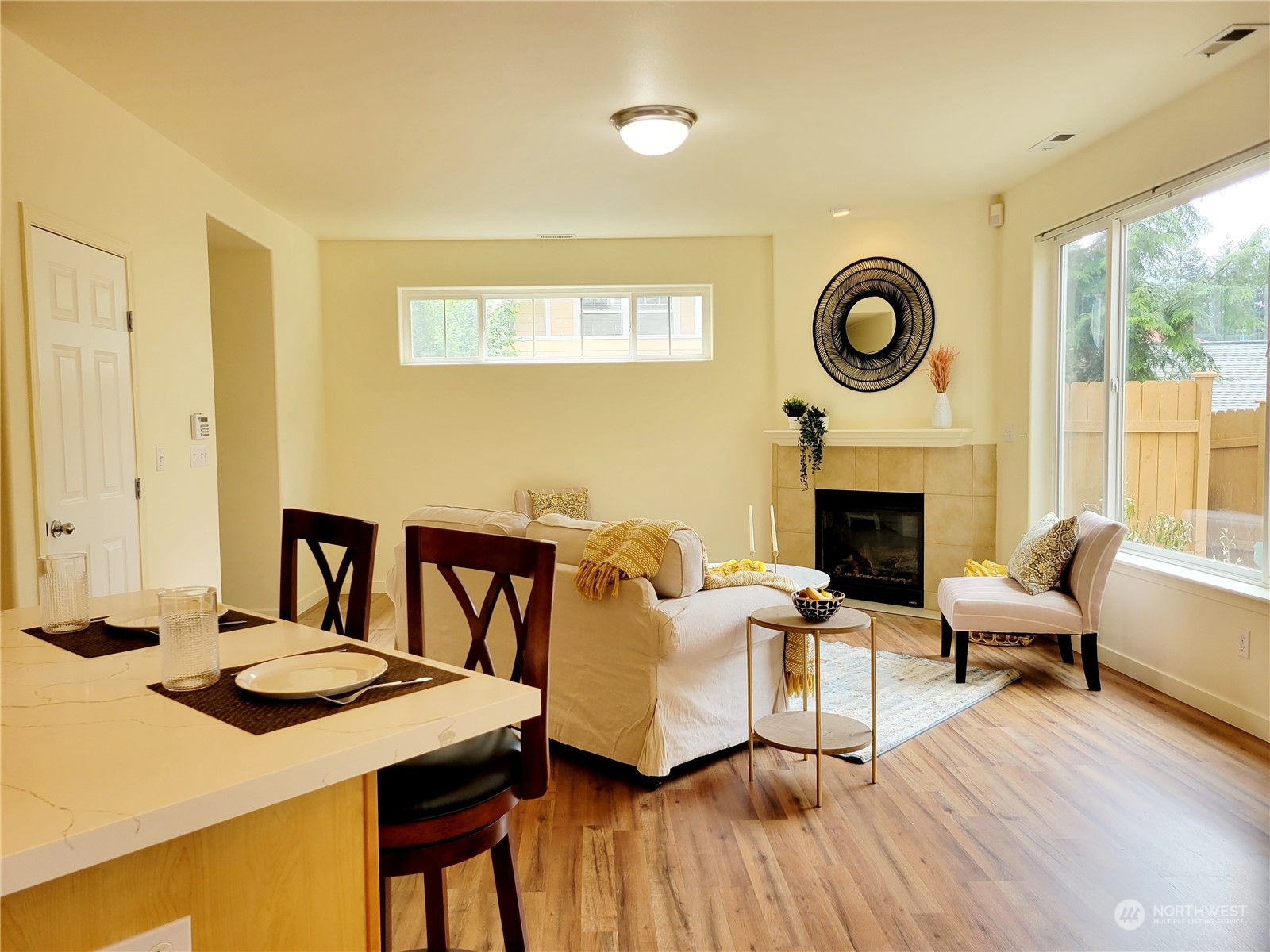 4019 Northeast 14th Place Renton, WA 98056 - Photo 4 of 21 a living room with furniture and a fireplace