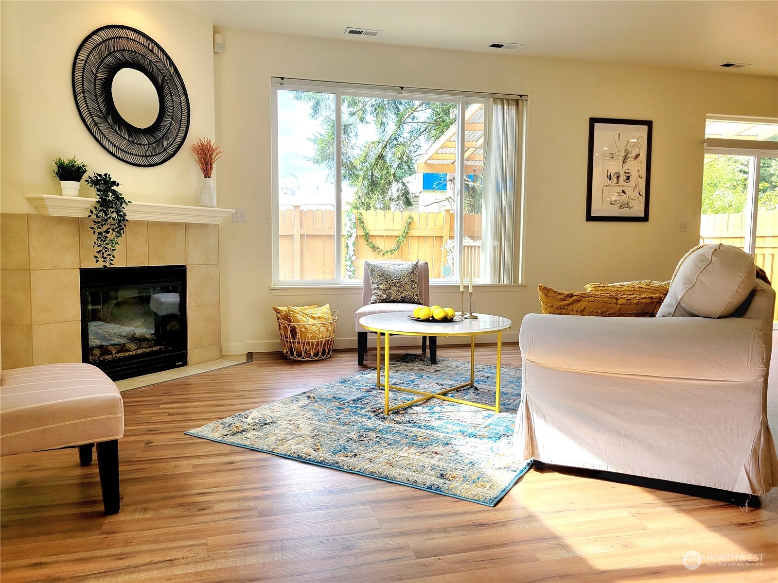 4019 Northeast 14th Place Renton, WA 98056 - Photo 5 of 21 a living room with furniture a window and a fireplace
