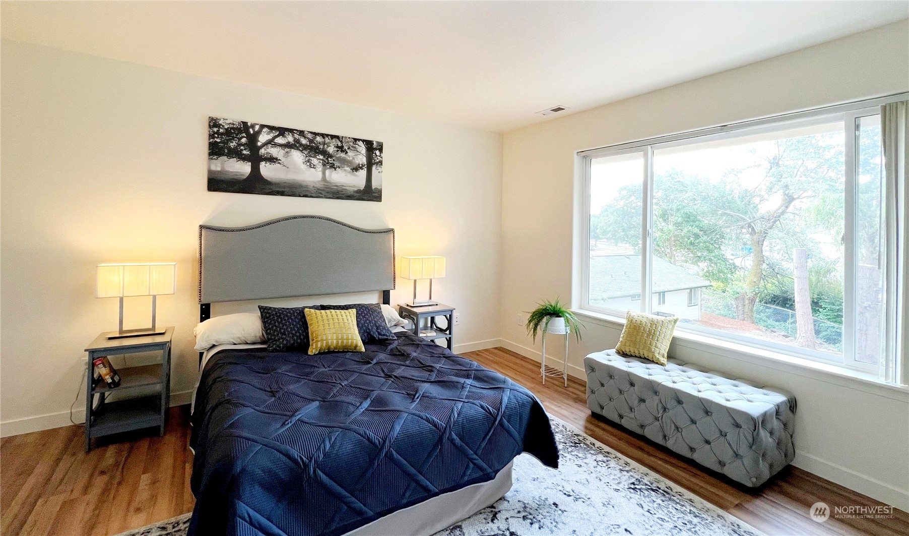 4019 Northeast 14th Place Renton, WA 98056 - Photo 10 of 21 a bedroom with a bed and a couch