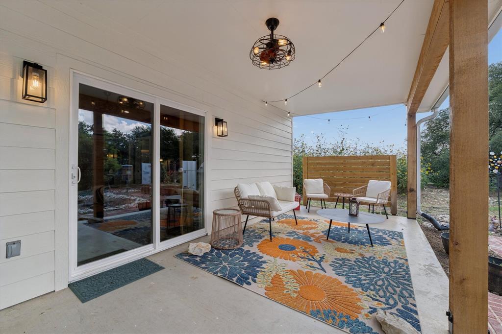 286 Benevolence Way China Spring, TX 76633 - Photo 25 of 37 Covered patio featuring a ceiling fan with integrated lighting, string lights, and a wood privacy fence