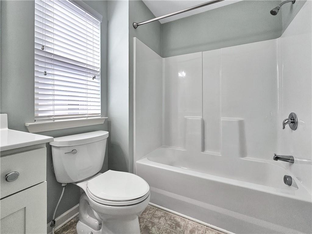 330 Avalon Square Fairburn, GA 30213 - Photo 43 of 52 a bathroom with a sink and a toilet