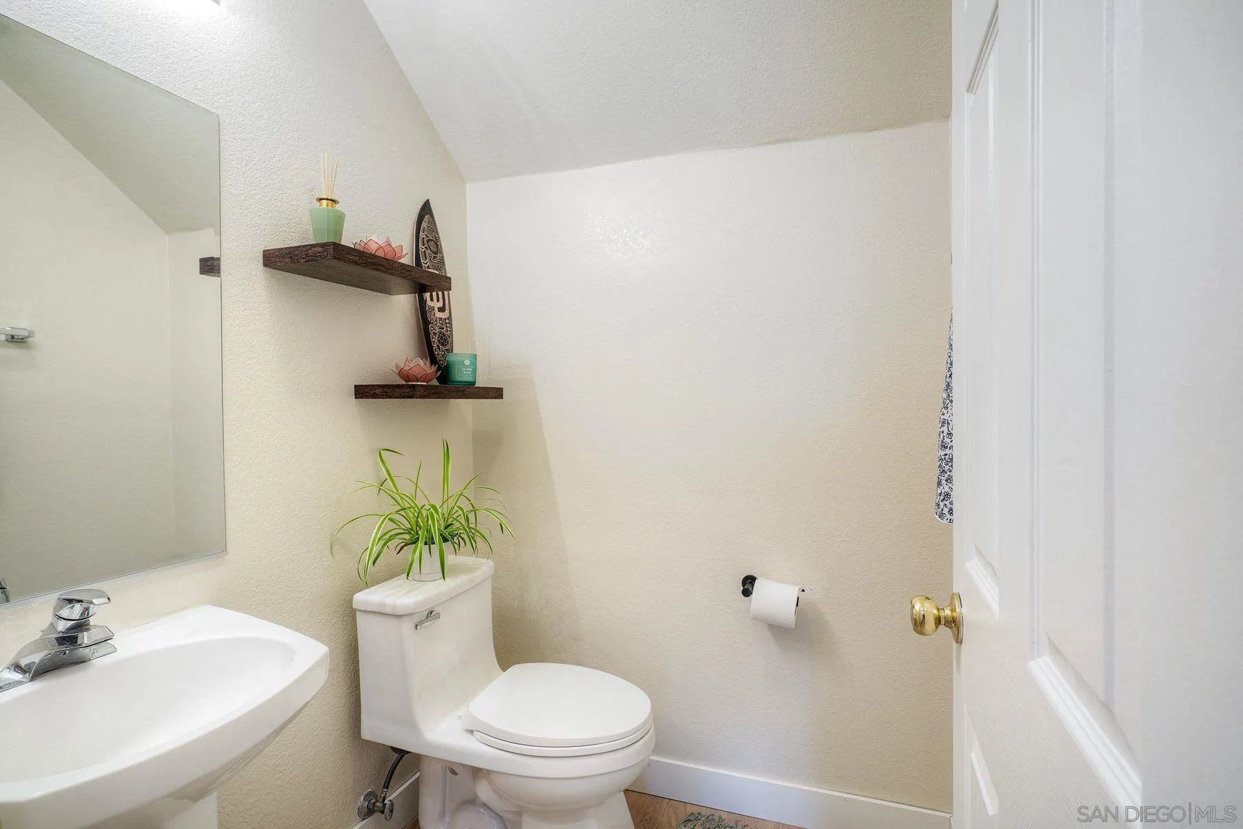 529 Peach Tree Way San Marcos, CA 92069 - Photo 12 of 30 a white toilet sitting next to a bathroom sink