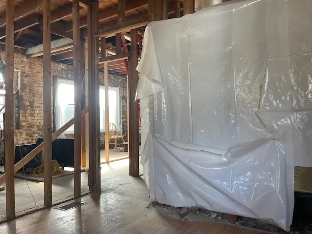 a view of empty room with wooden walls
