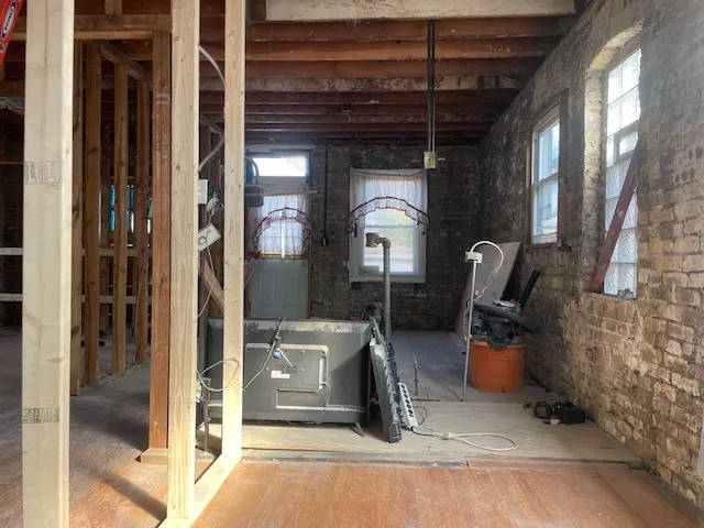 a view of living room kitchen and entryway