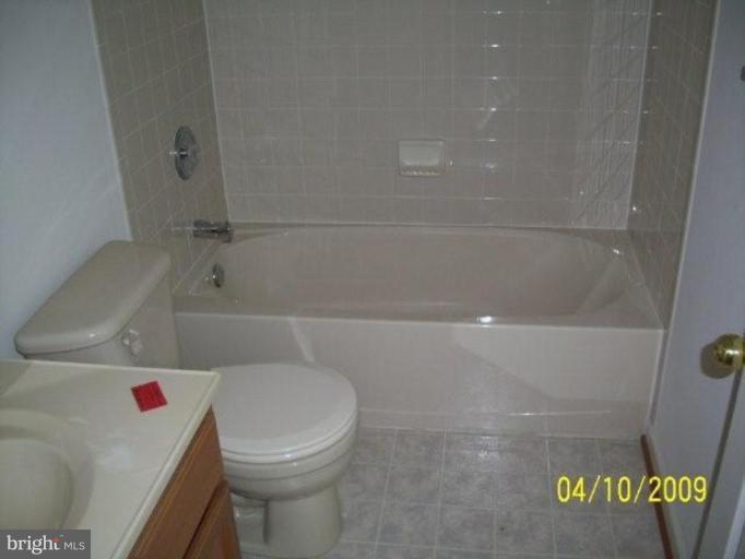 841 Middle River Road Middle River, MD 21220 - Photo 3 of 9 a white toilet sitting next to a bath tub