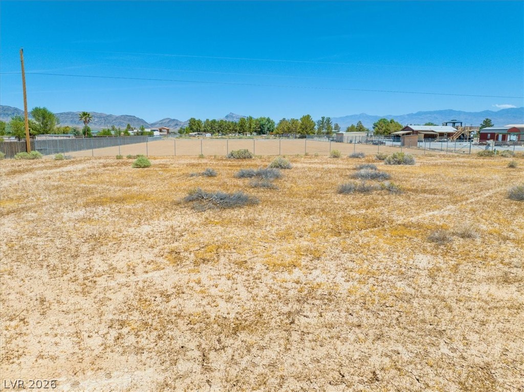 4610 Lawrence Road Pahrump, NV 89048 - Photo 11 of 42 A spacious, level lot offers ample room for future construction with mountain views.