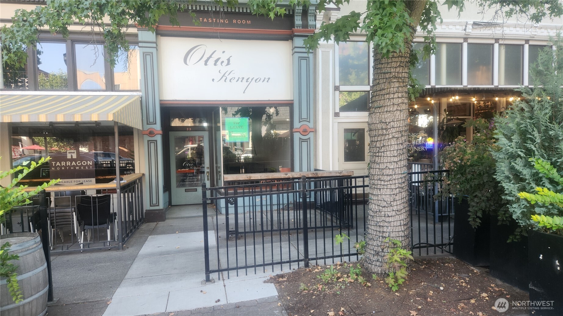 a view of a brick building with a sign on the wall