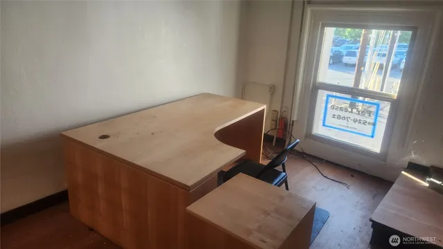 a workspace with furniture and window
