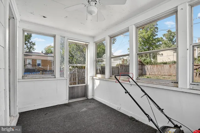 a view of an empty room with a balcony