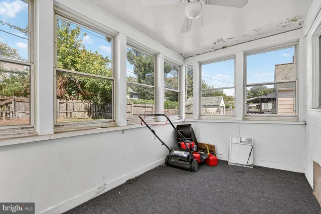 a view of a room with gym equipment and windows
